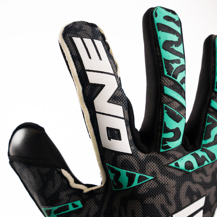 Close-up of the teal camo backhand on The One Glove OG1 Mentality Monster